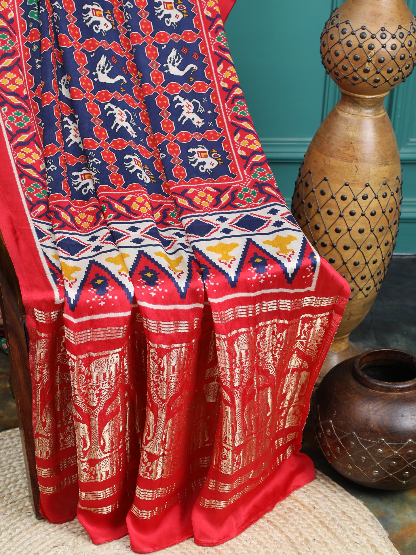 red & blue ikkat saree with tissue pallu