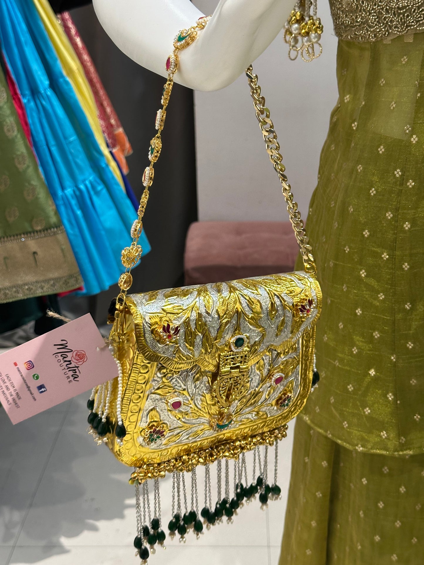 regal zari embroidered gold metal bag